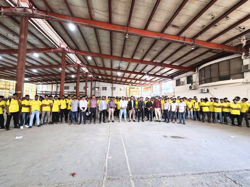 ITT trainees assembled in the workshop hall
