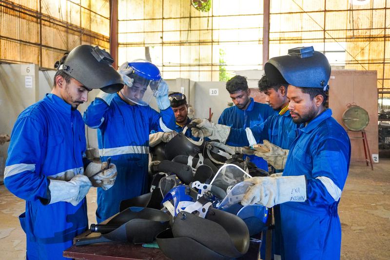 Trainees in welding PPE
